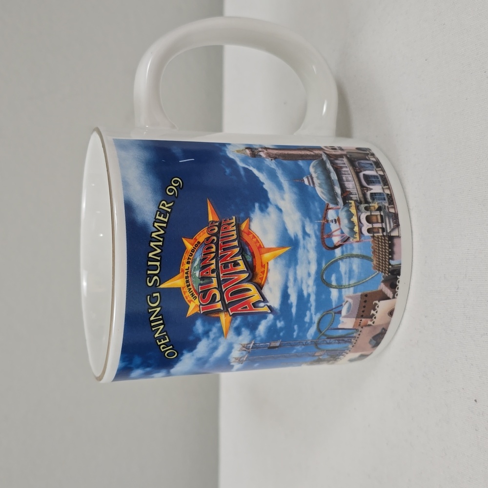 Vintage Universal Studios Islands of Adventure opening summer 1999 coffee mug